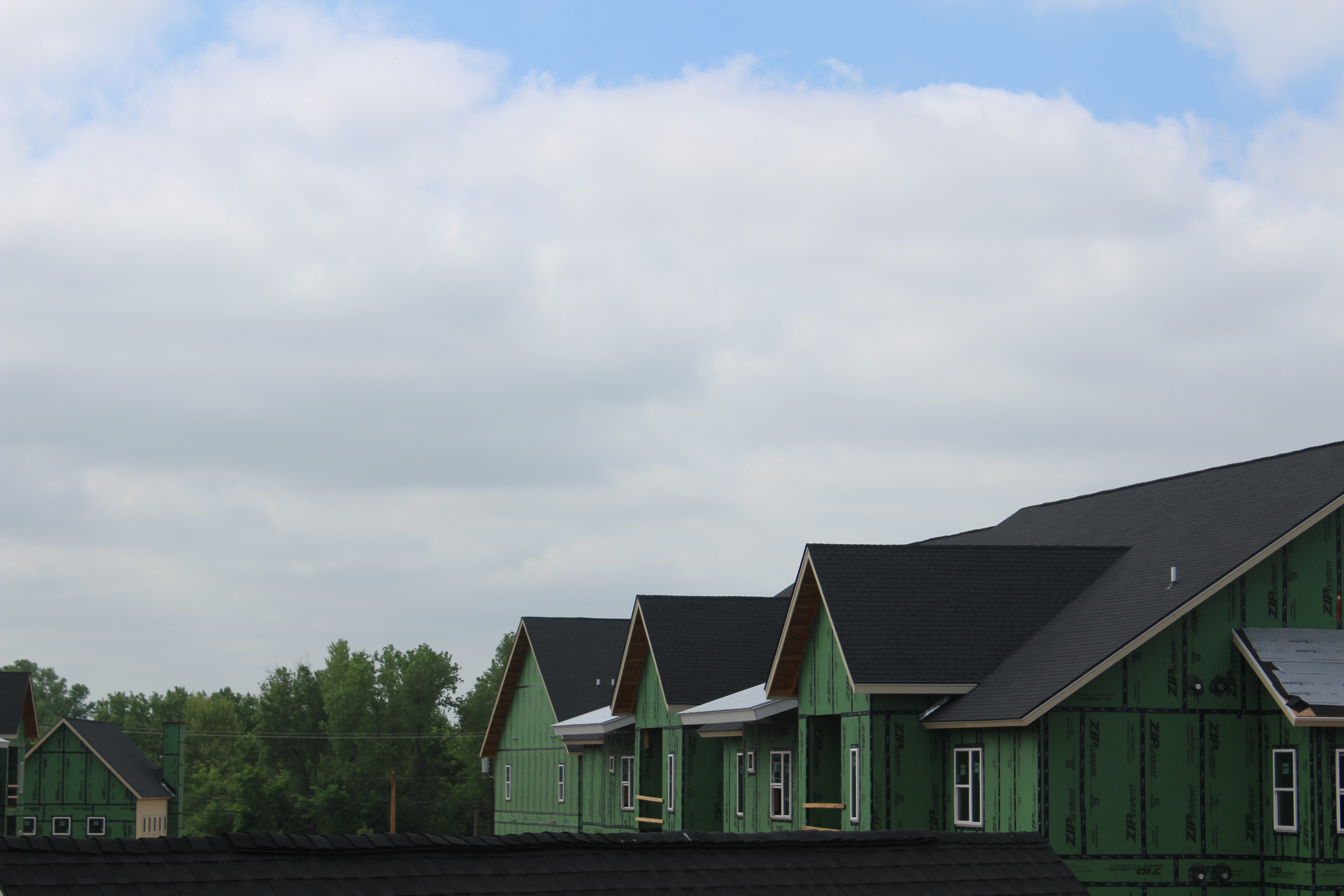 Large-scale multi-building roofing project by Premier Dwellings
