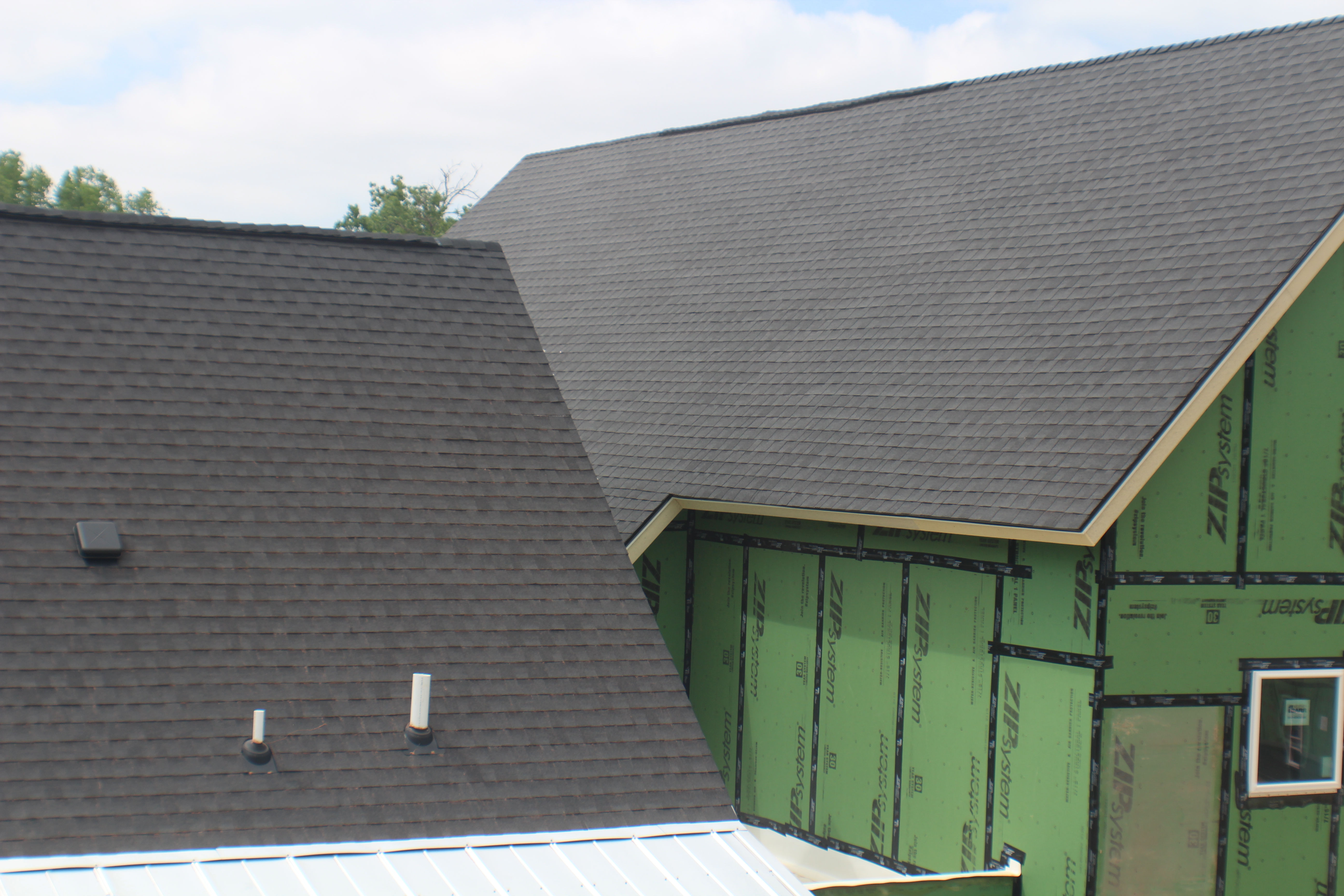 Metal canopy roof on commercial building entry